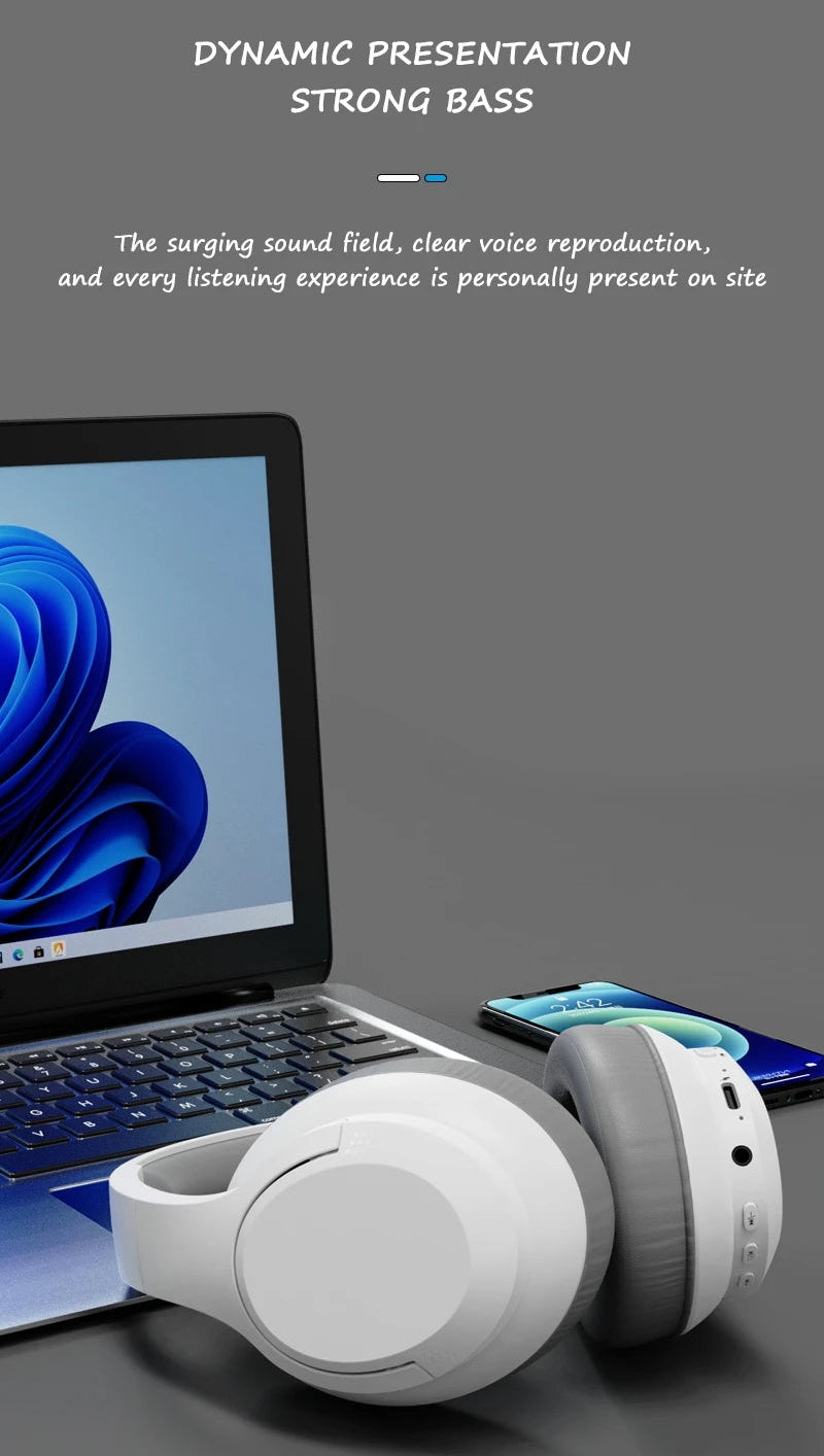 White headphones on a dark surface with a laptop and smartphone in the background, featuring text about sound quality.